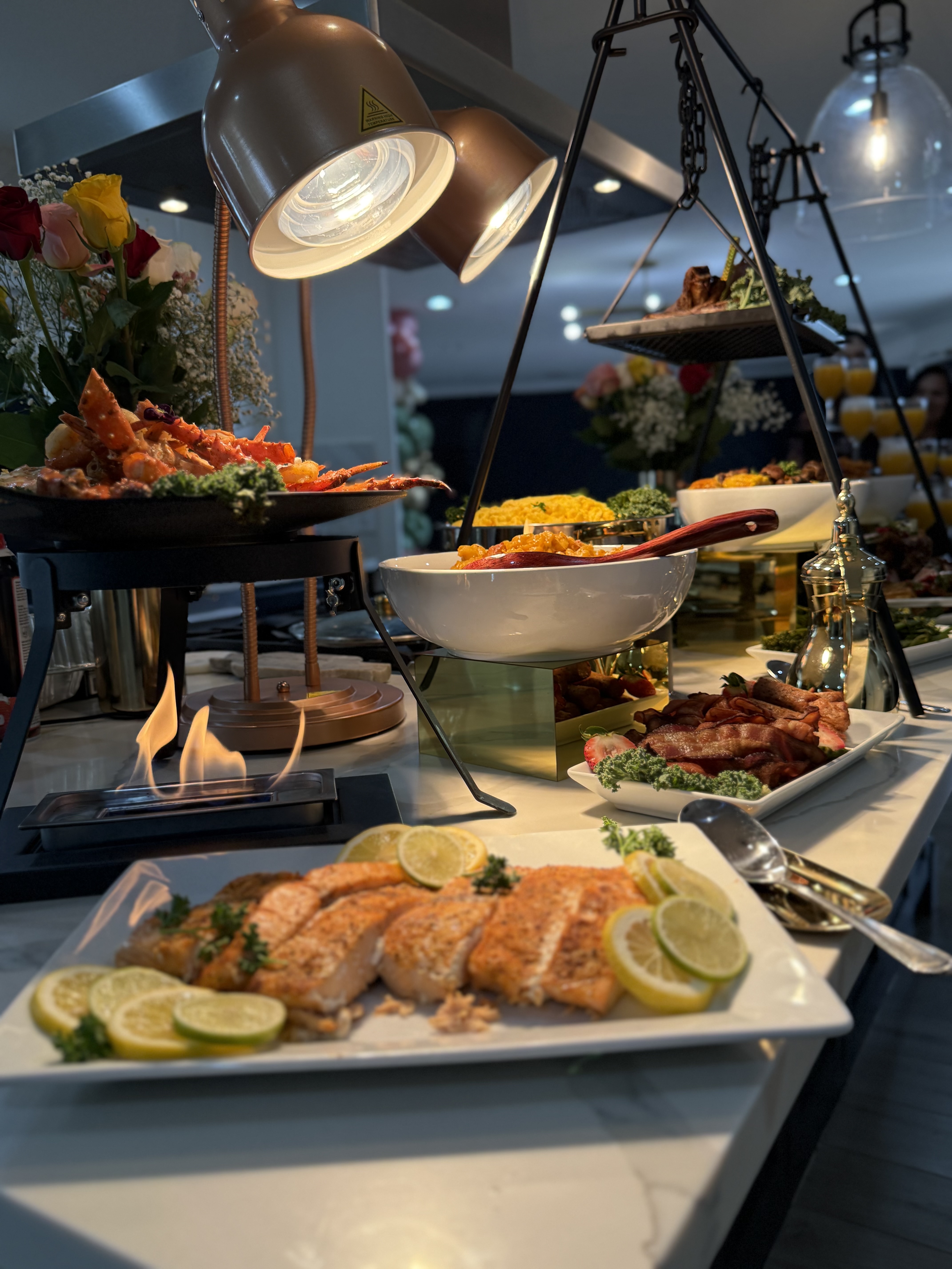 Chef G performing dramatic live fire cooking presentation for high-end corporate events and executive dinners